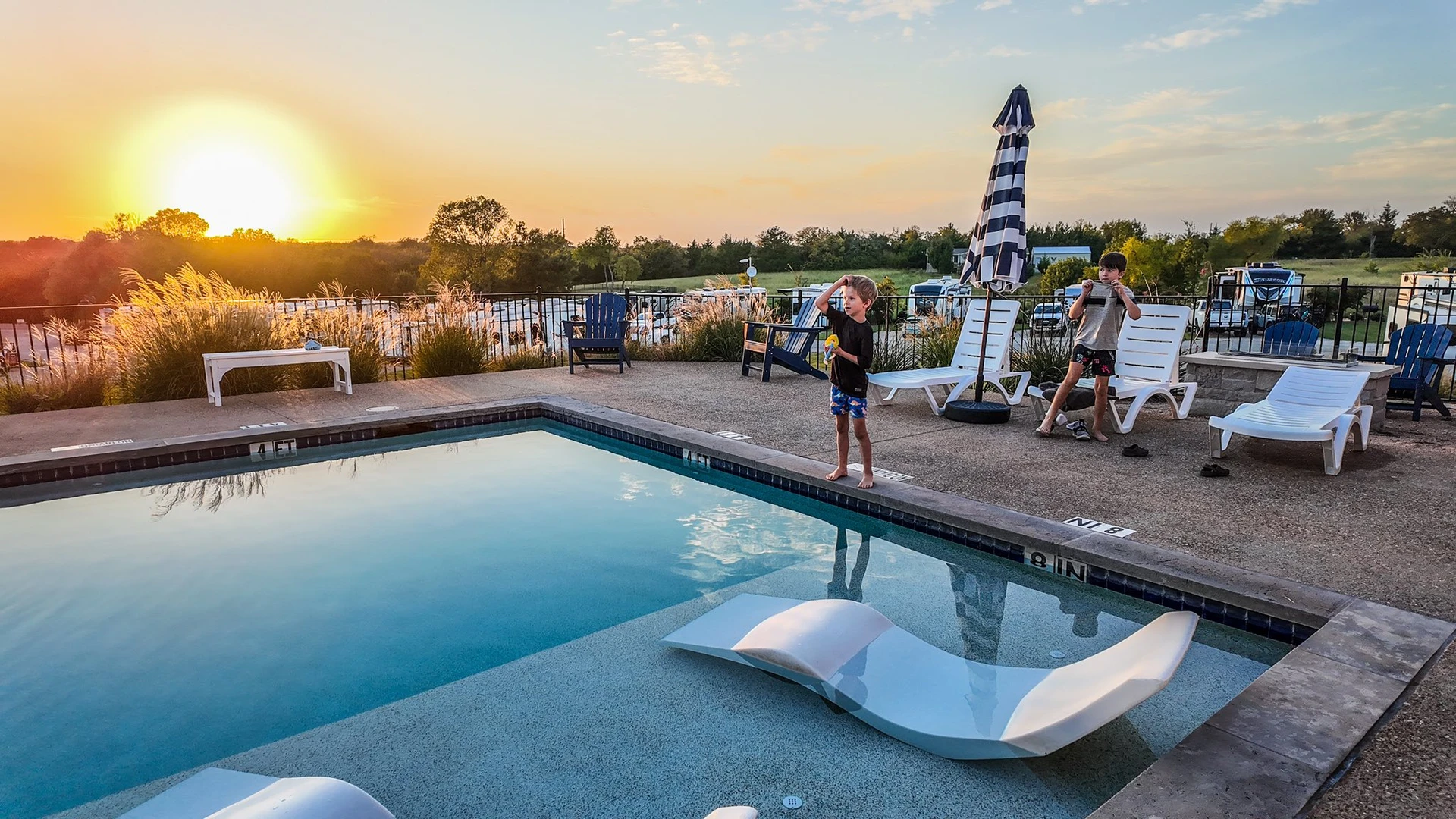 Bright resort pool and sun-shelf loungers at Sugar Hill — an open invitation to slow down and soak up the Texas sunshine.